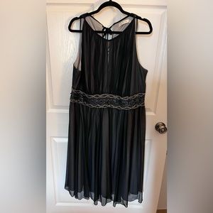 Laura Plus, Black cocktail dress. Beaded detail at waist.